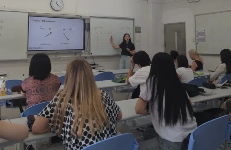 A friendly teacher taking a morning Mandarin class