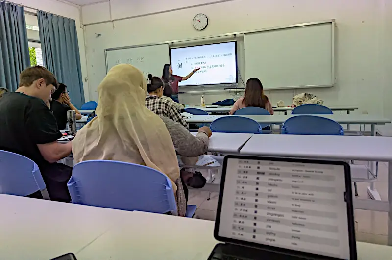 Morning intensive class at SCNU — teacher writing Chinese characters